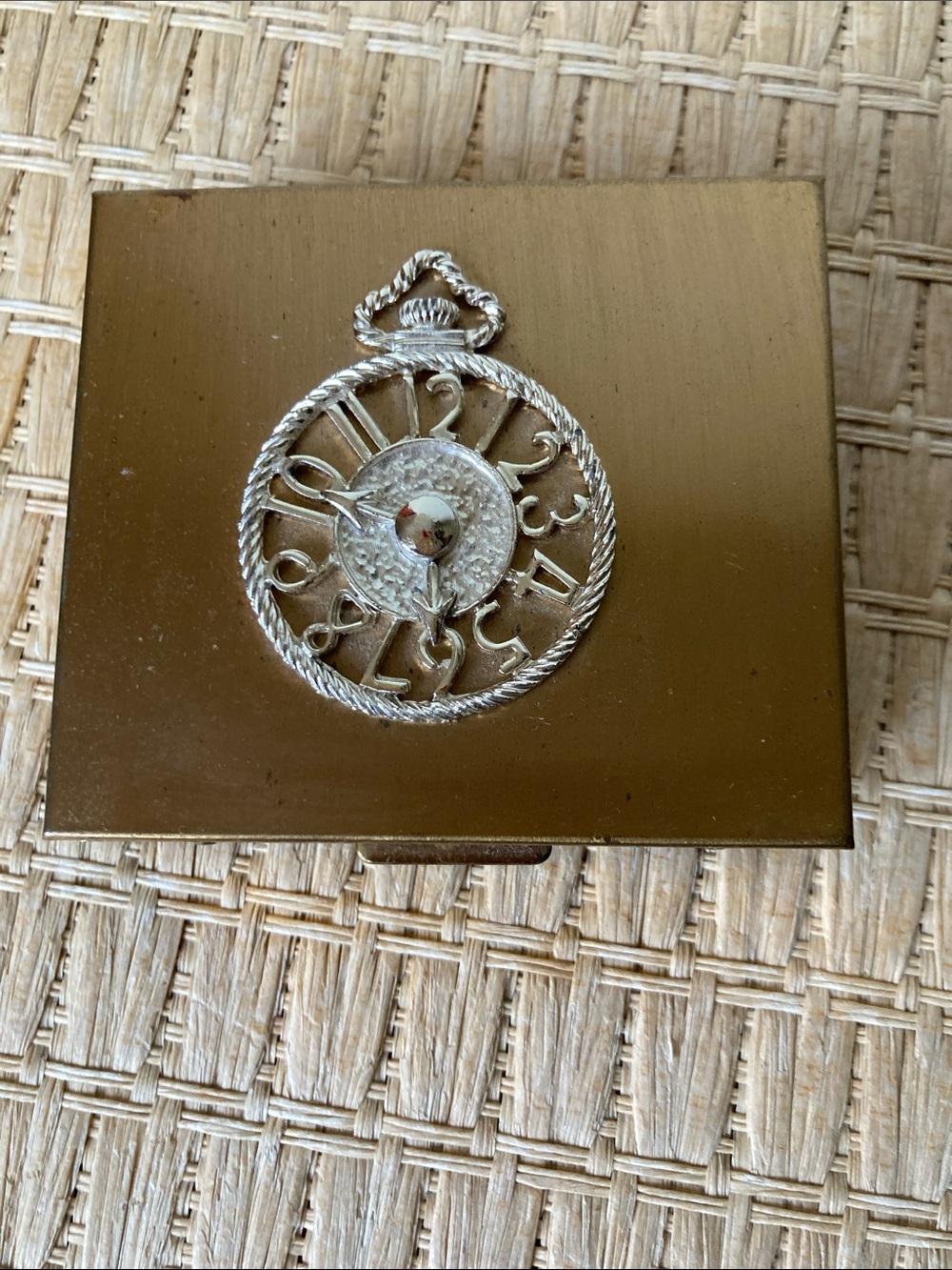 Vintage gold colored cigarette holder with silver clock